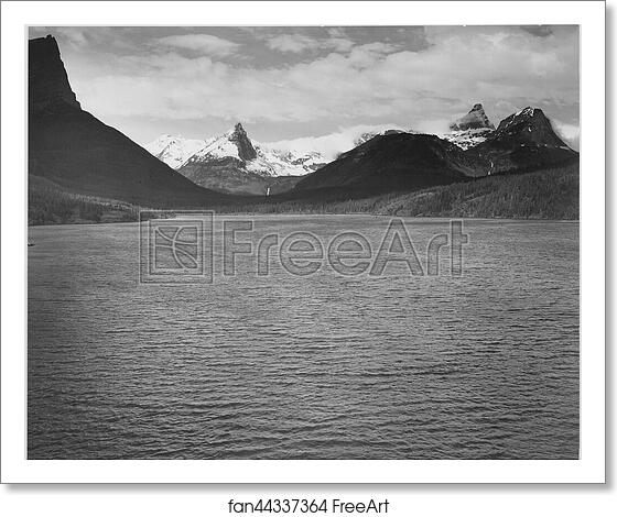 Free art print of Looking across toward snow-capped mountains, lake in foreground, "St. Mary's Lake, Glacier National Park," Montana.  Photographs of National Parks and Monuments, compiled 1941 - 1942, documenting the period ca. 1933 - 1942. by Ansel Adams (1902-1984)